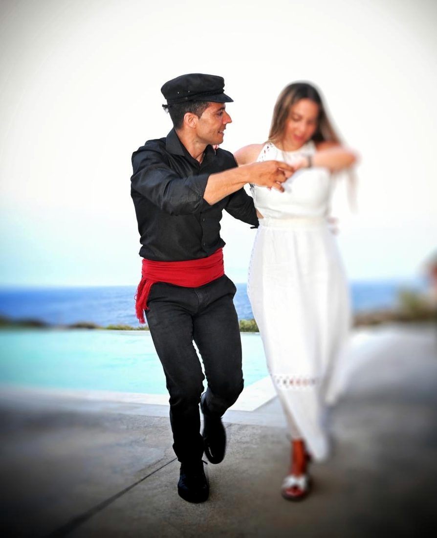 Greek dancers performing at a villa